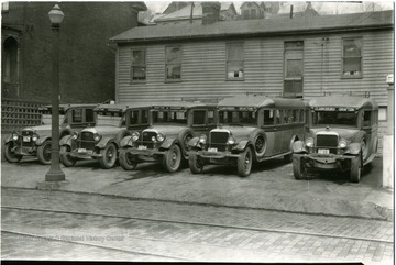 Five Bartlett Brothers buses in a parking lot, Grafton, W. Va.