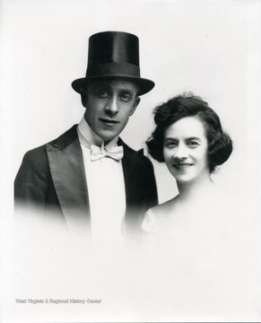 A woman and man wearing a top hat.