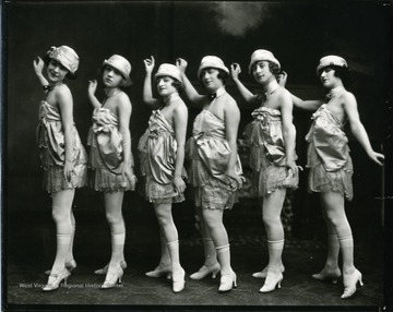 Six dancers in a line.