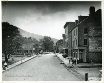 People are standing in front of the John Brown Exhibits building in Harpers Ferry, West Virginia.