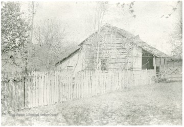 Gottfried Aegerter's first home in Helvetia, W. Va.  House surrounded by a picket fence.