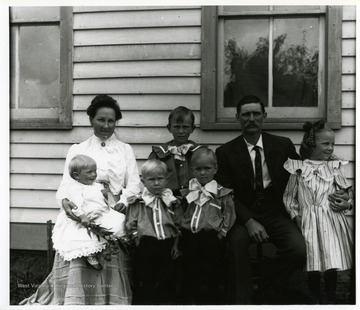 A group portrait of Otto and Annie Betler's family. Rear: Anna Hassig Betler, Henry Otto Betler, Otto Fredrich Betler, and Elsie Anna Frieda Betler. Front: unidentified, unidentified, and Lou Betler.