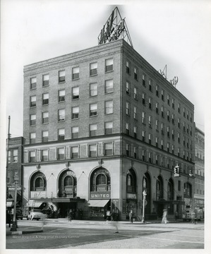 The front and side of the Hotel Cabell in Huntington, West Virginia with an Edison Loan Shop and United Cigar store.