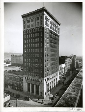 The Union Bank and Trust Company on the first floor of this tall Huntington building.  Other downtown buildings are also visible, including Hotel Frederick, Angel's Clothing, Gallagher Drugs, United Woolen and Kopy Kat clothing stores.