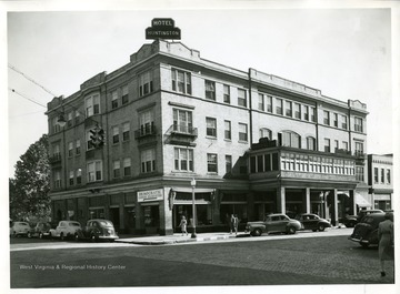 Automobiles are parked in front of the Hotel Huntington, home of the Democratic Campaign Headquarters.