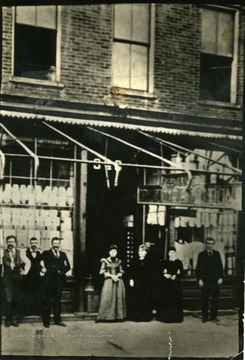 'In 1902, Huntington's Style Emporium, R. A. Jack Store, 3rd Aveune, north side, between 9th and 10th street. W. H. Newcomb at extreme right, John W. Valentine at left of doorway.'