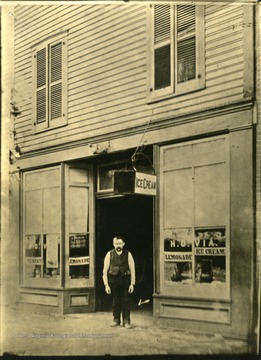 'In 1887. H. O. Via's restaurant. Huntington's Premier Eating Place 'away back when' located east side 9th St. between 3rd and 4th Avenues.  Mr. Via himself standing.'