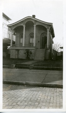 A small ornate house located at 1305 Third Avenue.