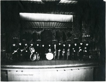 'From left to right: Ed Ennis, Loui Jacquet, unknown, Jack A. Dyer, Harry Damron, Frank Welling, Ralph Williams, Sam L. Ridenour, E. R. Wood, C. R. Arnold, Fred Rouillard, Eugene Latteral, Boyd Warren, Carl Damron.'