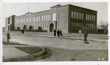 People are walking toward Monroe Elementary School, East View,Huntington, West Virginia.