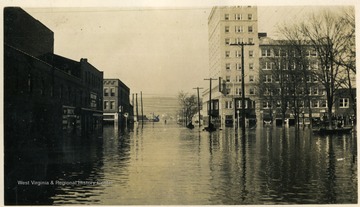 'Park Tower Hotel, Huntington, W. Va. at 7th St. and corner of the Court House lawn.  Where the X is located is the top of the city market completly underwater.'