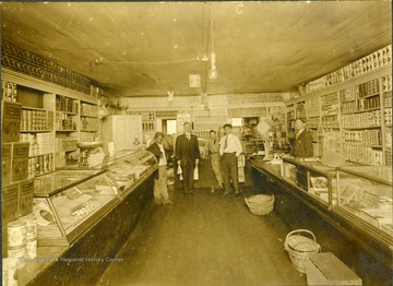 Five people stand inside the General Store. 'Frank Zimmerman.'