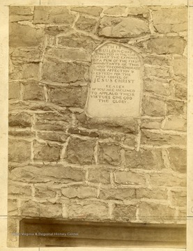 The inscription of the Old Stone Church in Lewisburg, West Virginia. The inscription reads: 'This building was erected in the year 1796 at the expence of a few of the first inhabitants of this land to commemorate their affection and esteem for the Holy Gospel of Jesus Christ. Reader if you are inclined to applaud their virtues give God the glory.'