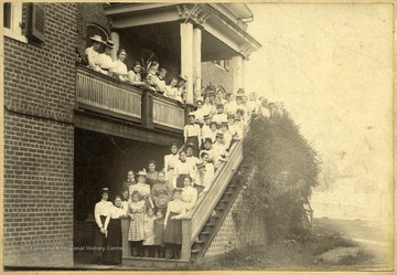 Women line the steps of a Lewisburg Female Institute building.