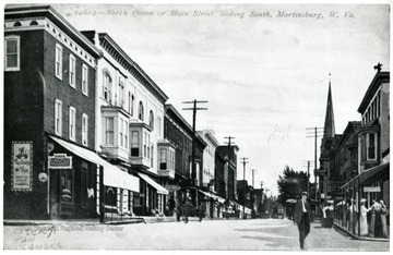 Peter Pan Cleaners and other buildings on North Queen or Main Street, looking South in Martinsburg, W. Va.