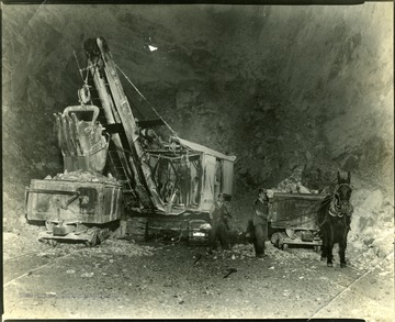 Two Standard Cement workers gathering and loading stone, Martinsburg, W. Va.