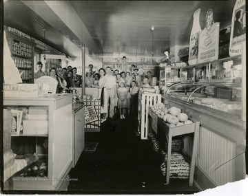 Group posing for a portrait inside the Spillman's Grocery Store in Martinsburg, West Virginia.