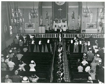 A church service inside St. Joseph's Church in Martinsburg, West Virginia.