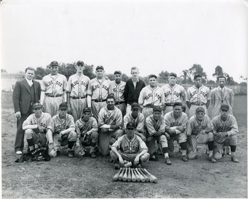 Team picture of the semi pro team the Blue Sox, Martinsburg, W. Va.  Front Row, Left to Right:  1) Chuck Kilmer, First Base 2) Carlton Johnson, Out Field 3) Lee Denton, Third Base 4) Hartgel Ambrose, First Base 5) Hunter Lamp, Second Base 6) Dulilier Brumbaugh, Bat Boy 7) Haywood Ledereck, Shortstop 8) Hack Wilson, Manager 9) Buddy Hesson, Cather 10) ? Stevens, Catcher.  Back Row, Left to Right: 1) Wesley Rice, Treasurer 2) Claude "Hop" Caske, Pitcher 3) Corky Ingrim, Pitcher  4) Sewel Roberts, Pitcher 5) Reggie Rawlings, Outfield 6) Paul Stotler, Business Manager 7) Bill Ambrose, Infield 8) Harry Brundle, Outfield 9) Wesley McDonald, Infield 10) George D. Walker, President.