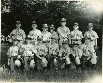 Group portrait of boys in baseball uniforms.