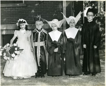 Five children (three girls and two boys) in religious costumes, Martinsburg, W. Va.