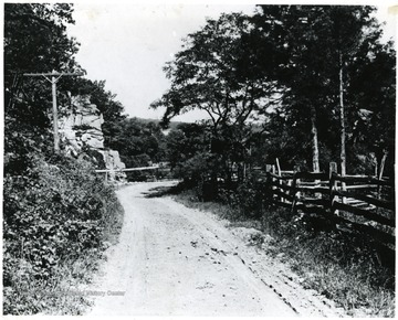 Dirt road running through a fenced area of the Martinsburg, W. Va. country side.