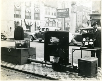 J.M. Ripple's Iron Fireman display on the side of a street, Martinsburg, W. Va.