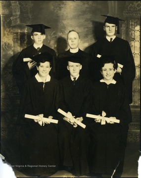 Five St. Joseph's graduates standing with their diplomas and a professor, Martinsburg, W. Va.