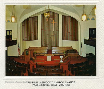 'Chancel of First Methodist Church, Parkersburg, West Virginia. Designed by Earl Stephens and Associate. In a design of redwood, oak, and travertine marble it portrays the centrality of the sacraments. The church, at 10th and Juliana Streets, serves over 1200 members.'