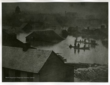 The Point during the flood of 1884 in Parkersburg, West Virginia. The Dome Building is the Wood County Court House.