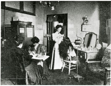 Women are doing hair and nails in the parlor.