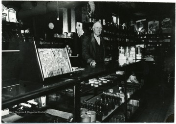 An unidentified man stands at the counter of a Shepherdstown Drugstore.<br />