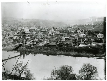 A portion of a panoramic view of Morgantown, West Virginia and the Morgantown/Westover Suspension Bridge.  For other portion of photograph see image 008062.