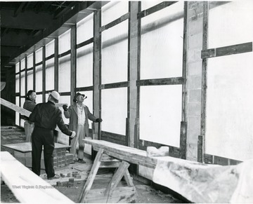 Men work on the inside of the bank.