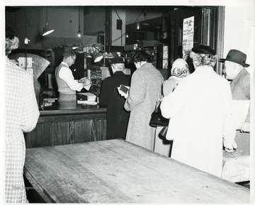 Customers are mailing their Christmas letters and packages at the Morgantown Post Office in Morgantown, West Office; Source: Gift-Dominion News Office through Tom Mills, City Editor, Morgantown, West Virginia.