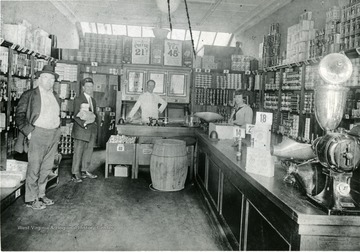 Old A&amp;P Food Store, Morgantown, W. Va., located on Walnut Street. Employees standing behind the counter, a few shoppers in store. 