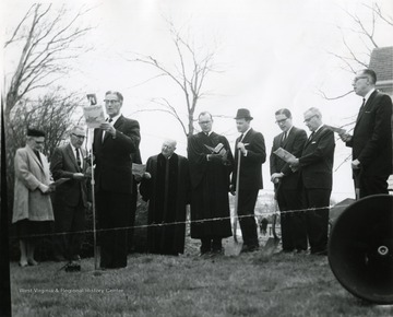 Ground breaking at the site of the Drummond Chapel. Located in Morgantown, W. Va. Some people attending are 'Reverend Charles High; L. Bush Swisher; Glen Liston, Bob Bennett; Chester Arents, Dean, College of Engineering.'