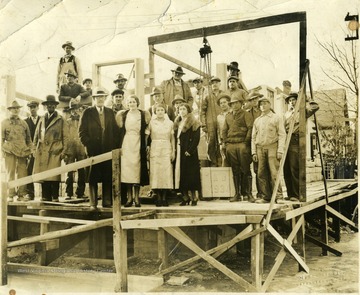 Large group of people standing on the Heiskell Hospital foundation, Morgantown, W. Va. 'Howard Straight.'