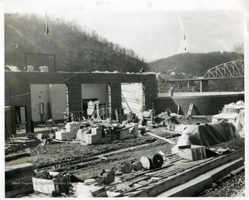 A construction worker is laying bricks at the Sewage Plant in Morgantown, West Virginia.