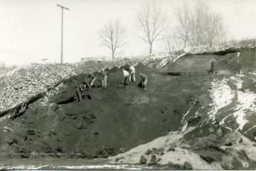 'City cinder and brick pile dumping (from old brick street torn up), behind State Road Commission Headquarters in Sabraton.'