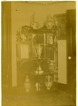 A close-up view of a Bric-a-Brac Cabinet at J.T. Lakin's residence, 21 Thirteenth Street in Wheeling, West Virginia