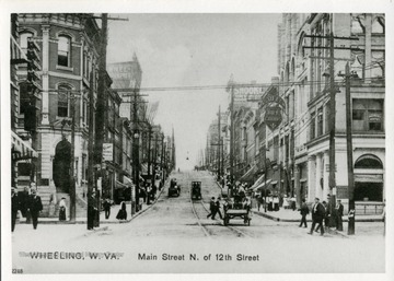A picture postcard of the Main Street North of 12th Street in Wheeling, West Virginia.