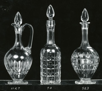 Three glass pieces numbered 1127, 90, 923..