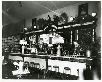 'Probably the soda fountain of Moore and Parriotts. The counterman is Harry Selby.'