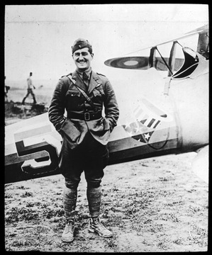 World War I Lantern Slide Show. Slide No. 32 in group of originally numbered slides.  Pilot Douglas Campbell of the 94th Squadron, 'Hat in the Ring.'  Nieuport 28 pursuit plane in background. Frame is labelled with text saying 'Visual Bureau, University of Pittsburgh.'  (negative no. 32-11888 is inscribed on slide)<br />