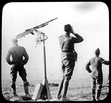 World War I Lantern Slide Show. Slide No. 37 in group of originally numbered slides.  Anti-aircraft gun and three soldiers.  Frame is labelled with text saying 'Visual Bureau, University of Pittsburgh.'  (negative no. 37-7593 is inscribed on slide)<br /><br /><br />
