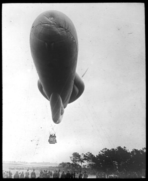World War I Lantern Slide Show. In group of originally numbered slides.  (Number label is lost.)  Observation balloon in air.  Soldiers are controlling the balloon with cables.  Frame is labelled with text saying 'Visual Bureau, University of Pittsburgh.'  (negative no. 43-9781 is inscribed on slide)<br />