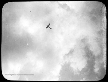 World War I Lantern Slide Show. In group of originally numbered slides.  (Number label is lost.)  Airplane in the sky.