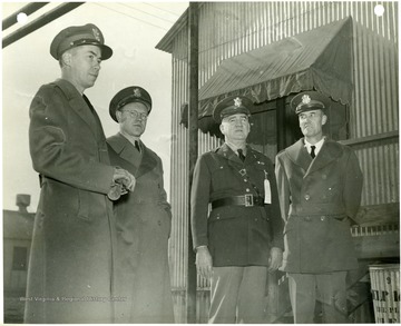 Men on the right are Maj. Gen. C. T. Harris Jr. and Lt. Col. John Huling.