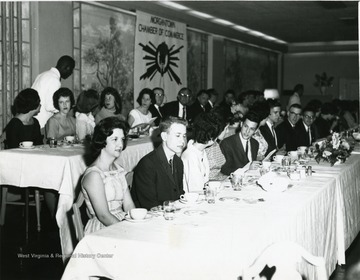 'Awards Banquet for Outstanding High School Seniors; Front Table- unknown, Conrad Clark, unknown, unknown, John Stuart, Nancy Theopolis, Ed Barnett, Dan Henry, Bill Hall. Back Table- unknown, Carol Headley, unknown, Carolyn Jacobs, Sarah Gibbard, Charles Stevenson (Superintendent of Schools), unknown, John F. Golay (featured speaker). 